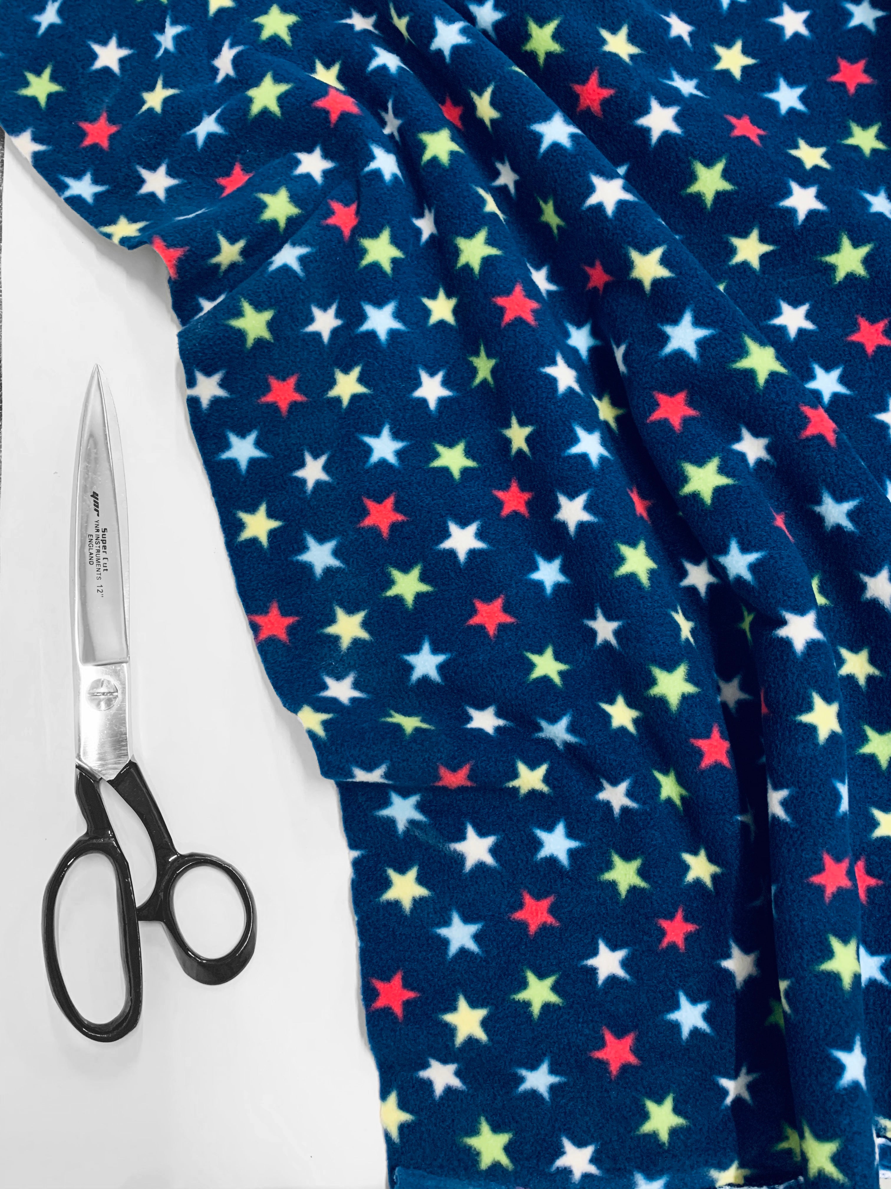 Buy navy-multi-stars Printed Polar Fleece Fabric Spots &amp; Stars Prints