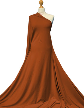 Buy rust Bamboo Jersey Fabric - 4 Way Stretch Soft Dressmaking Fabric by the Metre